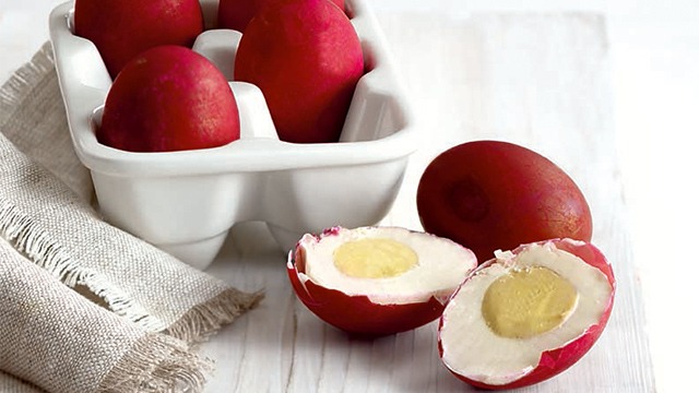 salted eggs on a white table and ceramic egg tray