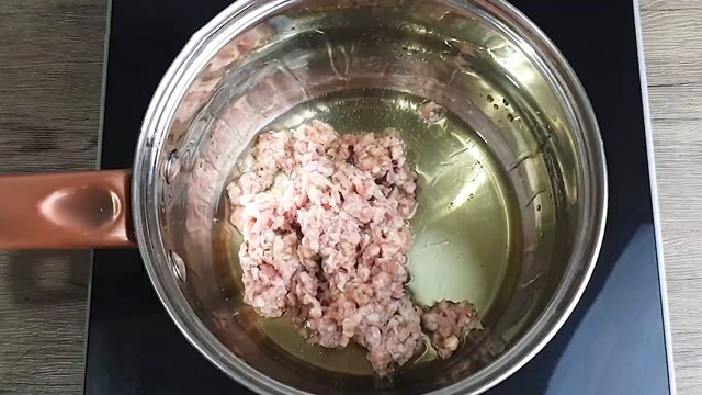 ground pork in oil in a saucepan